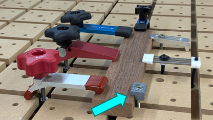 A diminutive EdgeHugger clamp is shown alongside several conventional hold-down clamps.