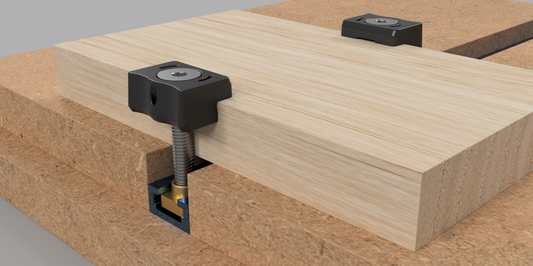 EdgeHugger clamp heads are used with T-track and Track Boss T-nuts to secure a workpiece [T-track]